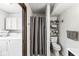 Practical bathroom includes a washer and dryer, storage cabinets, and neutral color palette at 3090 N County Road 800 E Rd, Brownsburg, IN 46112