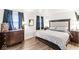 This spacious bedroom features hardwood floors, decorative lamps, and a beautiful bed frame at 3090 N County Road 800 E Rd, Brownsburg, IN 46112