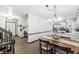 Warm dining area features tile floors, modern light fixture, and seamless transition to the kitchen at 3090 N County Road 800 E Rd, Brownsburg, IN 46112