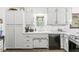 Close up of the kitchen sink and counters, featuring white cabinets and modern fixtures at 3090 N County Road 800 E Rd, Brownsburg, IN 46112
