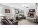 Cozy living room with a brick fireplace, comfortable seating, and a ceiling fan at 3090 N County Road 800 E Rd, Brownsburg, IN 46112