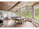 Bright sunroom with hardwood floors, natural light, exposed wood beams, and outdoor views at 3090 N County Road 800 E Rd, Brownsburg, IN 46112