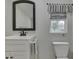 Clean bathroom features a white vanity and toilet with a simple, neutral color scheme at 3641 Harrison St, Needham, IN 46162