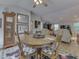 Inviting dining area features a wooden table set and blends into the living room for a spacious feel at 3641 Harrison St, Needham, IN 46162