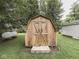 A wooden shed in the backyard offers storage space for gardening equipment or outdoor gear at 3641 Harrison St, Needham, IN 46162