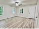 Bright bedroom with new floors, neutral walls, a ceiling fan, and great natural light from multiple windows at 3712 S Kealing S Ave, Indianapolis, IN 46237