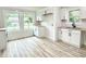 Bright, all-white kitchen featuring modern cabinetry, butcher block counters, and abundant natural light at 3712 S Kealing S Ave, Indianapolis, IN 46237