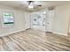 Inviting living room featuring modern flooring, neutral paint, and an easy flow to the updated kitchen at 3712 S Kealing S Ave, Indianapolis, IN 46237