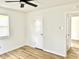 Bedroom featuring a closet, new flooring, and a doorway into another room at 405 E Cowing Dr, Muncie, IN 47303
