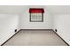 Comfortable attic with carpet, natural light, and a window that is partially covered at 4070 Serenity Way Ct, Greenwood, IN 46142