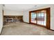 Finished basement with tile flooring, a brick fireplace, and sliding glass doors to an outdoor area at 4070 Serenity Way Ct, Greenwood, IN 46142