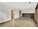 Open basement area with tile flooring and a brick fireplace at 4070 Serenity Way Ct, Greenwood, IN 46142