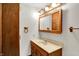 Bathroom features a vanity with light wood cabinets and a large mirror at 4070 Serenity Way Ct, Greenwood, IN 46142