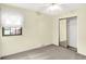 Comfortable bedroom with natural light, ceiling fan, carpet and a closet with mirrored doors at 4070 Serenity Way Ct, Greenwood, IN 46142