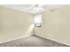 Neutral-toned bedroom with natural light, ceiling fan, and closet, perfect for relaxation at 4070 Serenity Way Ct, Greenwood, IN 46142