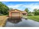 Spacious driveway leads to an attached garage, complemented by fresh landscaping and verdant lawn at 4070 Serenity Way Ct, Greenwood, IN 46142