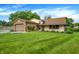 Charming home boasts a brick-and-siding facade, lush lawn, attached garage, and colorful landscaping at 4070 Serenity Way Ct, Greenwood, IN 46142