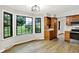 Kitchen featuring hardwood floors, natural cabinets, and a large bay window at 4070 Serenity Way Ct, Greenwood, IN 46142