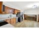 A kitchen with stainless steel appliances, natural wood cabinets, and hardwood floors at 4070 Serenity Way Ct, Greenwood, IN 46142