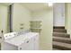 Well-lit laundry room featuring a washer, dryer, shelving and a door to the exterior at 4070 Serenity Way Ct, Greenwood, IN 46142