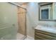 Bathroom with glass enclosed shower, modern vanity, and bright lighting at 4903 E Naomi St, Indianapolis, IN 46203