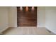 Bedroom with wood accent wall, neutral carpet, and bright recessed lighting at 4903 E Naomi St, Indianapolis, IN 46203