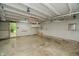 Empty garage interior features pegboard walls, concrete floor, and ample space for parking or storage solutions at 4903 E Naomi St, Indianapolis, IN 46203