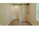 Hallway featuring a sliding barn door adding rustic charm and visual interest to the space at 4903 E Naomi St, Indianapolis, IN 46203