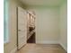 Living space with hardwood floors and a doorway leading to a stylish room with a stone feature wall at 4903 E Naomi St, Indianapolis, IN 46203