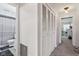 Hallway with a closet, leading into a bathroom; maximizes functionality and storage in a well-organized layout at 5152 Coppertree Ln, Avon, IN 46123