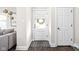 Bright foyer features a decorative mat and front door with glass inserts at 519 Sutherland Ave, Indianapolis, IN 46205