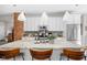 Bright kitchen island featuring granite countertops, pendant lights, and barstool seating at 519 Sutherland Ave, Indianapolis, IN 46205