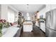 Bright, open-concept kitchen featuring a large island, stainless steel appliances, and modern white cabinetry at 519 Sutherland Ave, Indianapolis, IN 46205