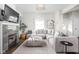 Bright living room features a fireplace, television, and comfortable sectional sofa at 519 Sutherland Ave, Indianapolis, IN 46205