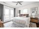 Bright main bedroom with balcony access, ceiling fan, and cozy decor at 519 Sutherland Ave, Indianapolis, IN 46205