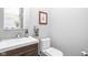 Stylish powder room with a modern sink, vanity, and contemporary decor at 519 Sutherland Ave, Indianapolis, IN 46205