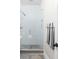 Bright, renovated bathroom featuring tiled shower with glass door and a neutral color palette at 519 Sutherland Ave, Indianapolis, IN 46205