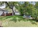 Backyard with a fire pit area and lush green lawn, perfect for outdoor gatherings at 5363 Primrose Ave, Indianapolis, IN 46220