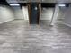 Large finished basement with dark-painted ceiling and new light gray flooring at 5363 Primrose Ave, Indianapolis, IN 46220