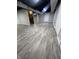 Large finished basement with durable gray vinyl flooring and a dark painted ceiling at 5363 Primrose Ave, Indianapolis, IN 46220