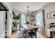 Elegant dining room with wood floors, chandelier, and stylish table setting at 5363 Primrose Ave, Indianapolis, IN 46220