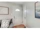 Light-filled entryway showcasing a white door with glass details and fresh paint at 5363 Primrose Ave, Indianapolis, IN 46220