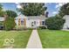 Charming single-story home with manicured lawn and inviting front porch at 5363 Primrose Ave, Indianapolis, IN 46220