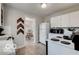 Efficient kitchen with white cabinets, and view into adjacent dining area at 5363 Primrose Ave, Indianapolis, IN 46220