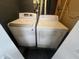A laundry room with a white LG washer and a white dryer at 5363 Primrose Ave, Indianapolis, IN 46220