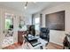 Bright home office space with hardwood floors and a large map on the wall at 5363 Primrose Ave, Indianapolis, IN 46220