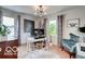 Bright office space with hardwood floors, modern lighting, and a cozy blue chair at 5363 Primrose Ave, Indianapolis, IN 46220