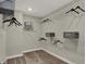 Organized walk-in closet with multiple shelves and hanging rods at 5363 Summerton St, McCordsville, IN 46055