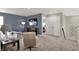Loft featuring comfortable chair, television and an open doorway to an additional room at 5363 Summerton St, McCordsville, IN 46055