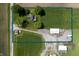 Aerial shot of the property showcasing the home, outbuildings, and land at 5396 N 1000 E, Sheridan, IN 46069